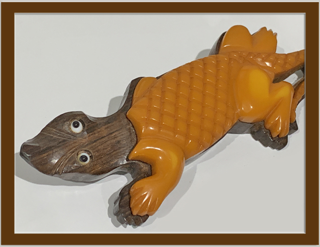 1930's CARVED BUTTERSCOTCH BAKELITE and WOOD LAMINATED ALIGATOR BROOCH.