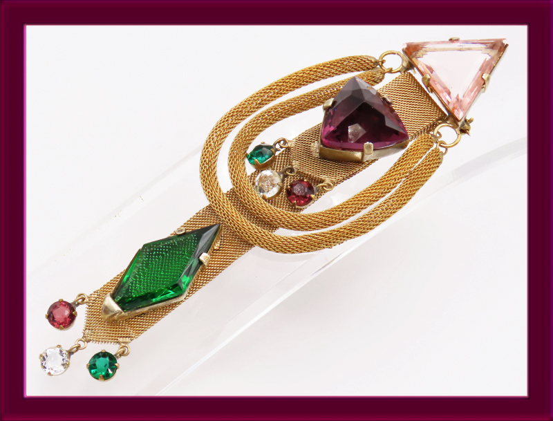 Adele-Simpson-large-gold-mesh-riboon-brooch-with-cut-glass-gems