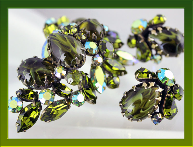 Dramatic Olive and Black Art Glass set off this impressive Regency demi.